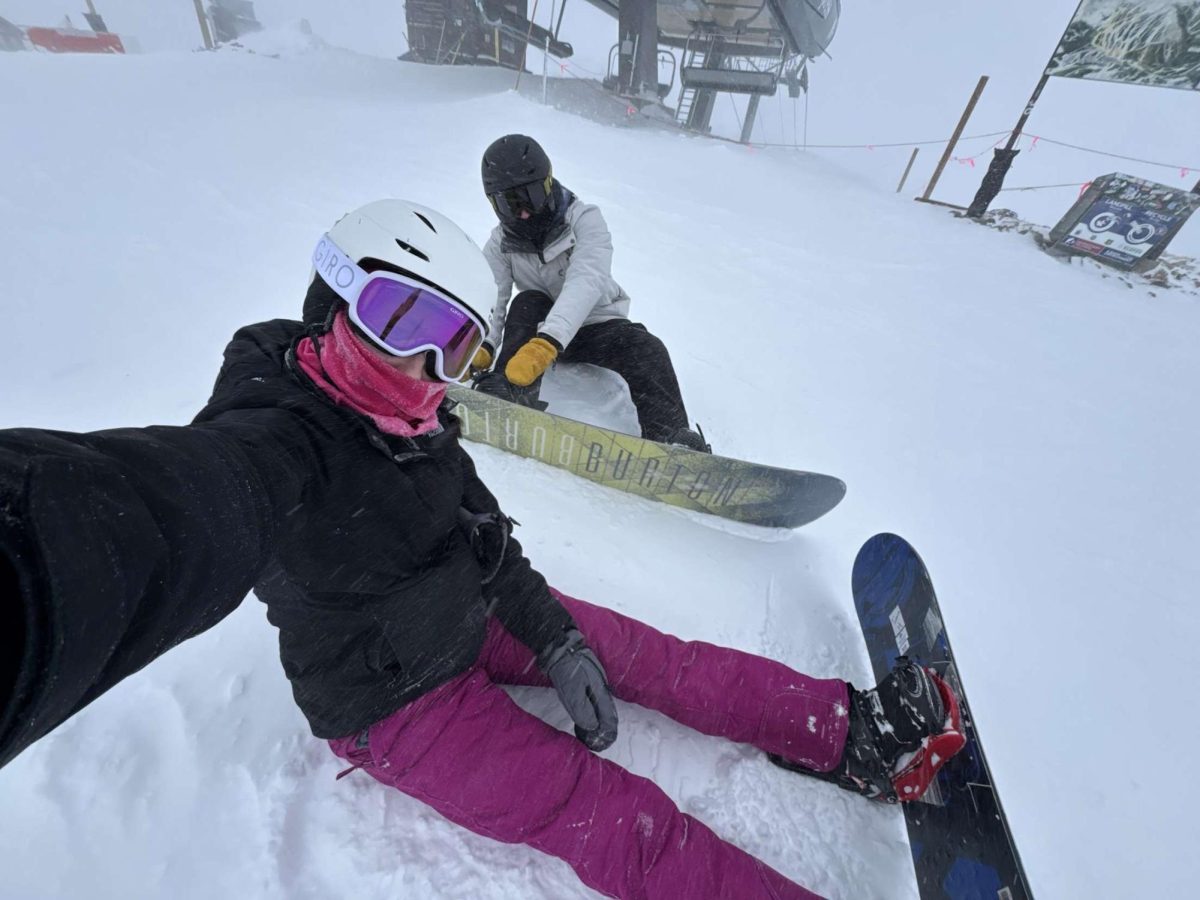 Seniors Loganne Barta and Bennett Ell Snap a pic while strapping in. They went on this slope as a duo instead of with the group.