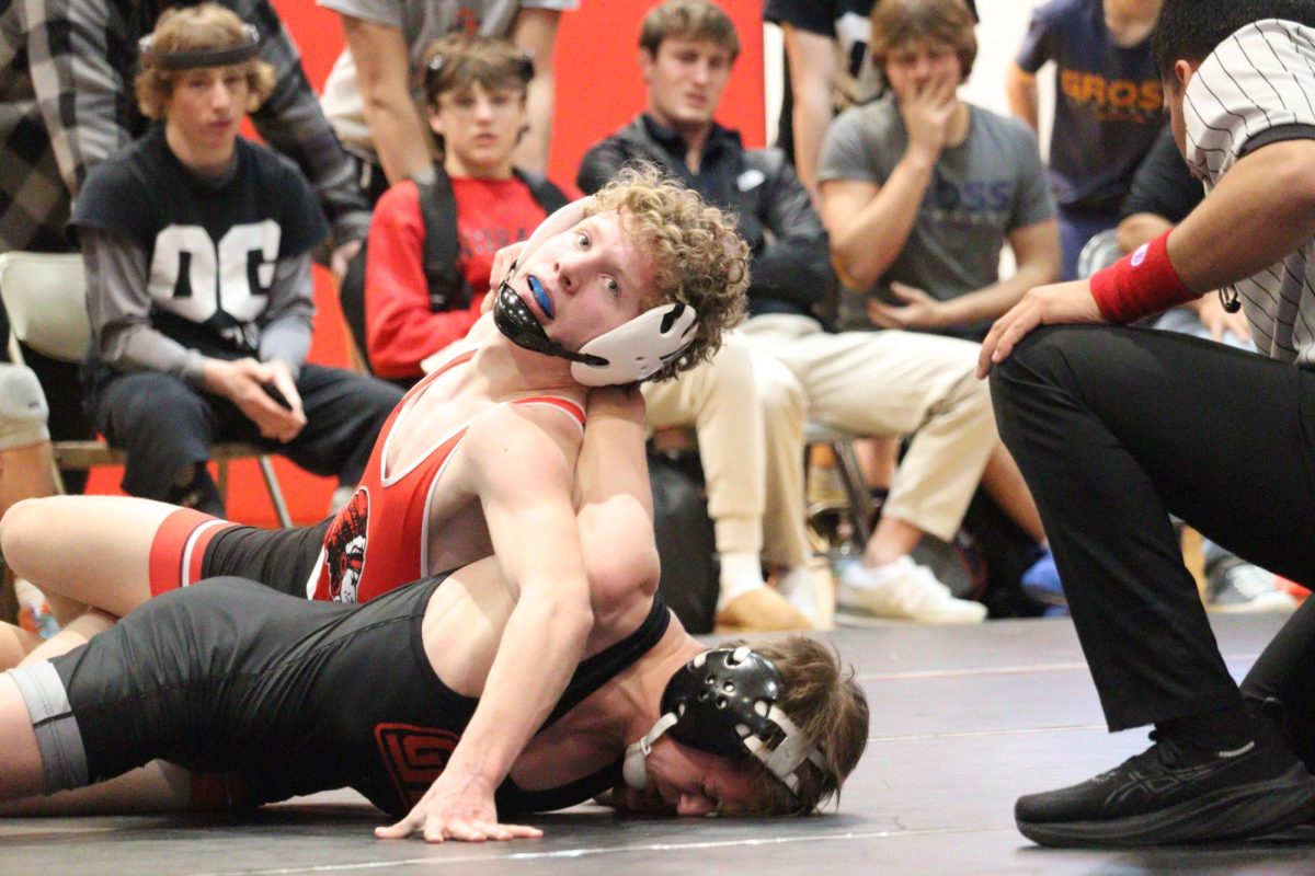 At the home triangular, sophomore Eli Kult looks to turn his opponent. So far, Kult's career record is 69-5.