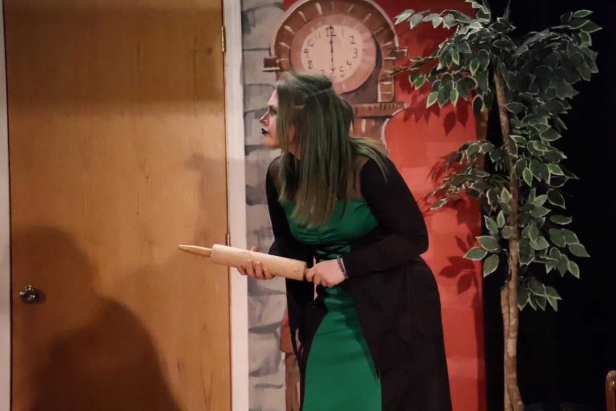 Freshman Gracie Copple argues whether or not she was trying to kill the gingerbread man. This is Copple first year in the play.