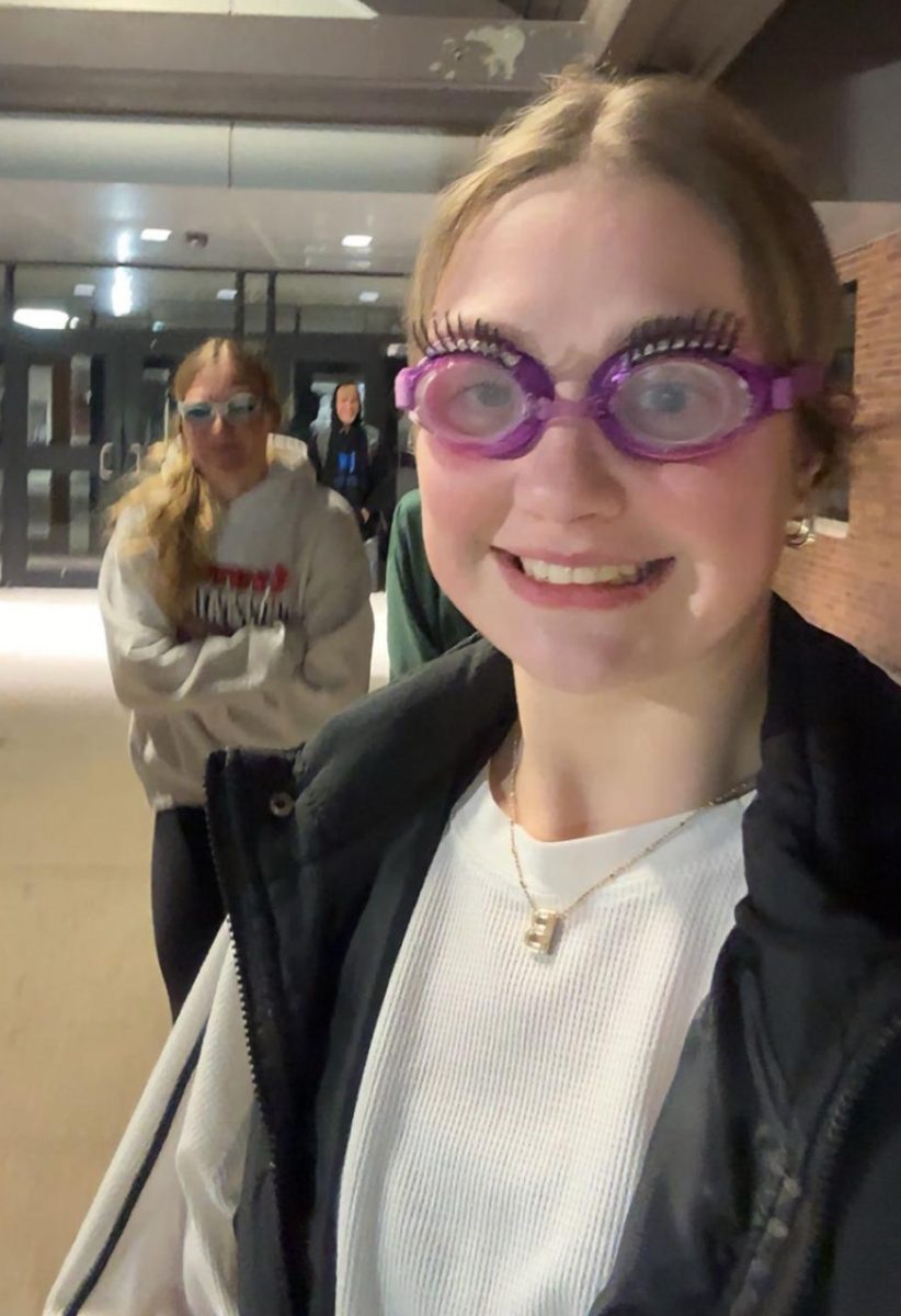 Seniors Gabi Tederman and Britney Zeleny walk out of Yutan High School with their goggles on. Wearing goggles shielded people from getting eliminated