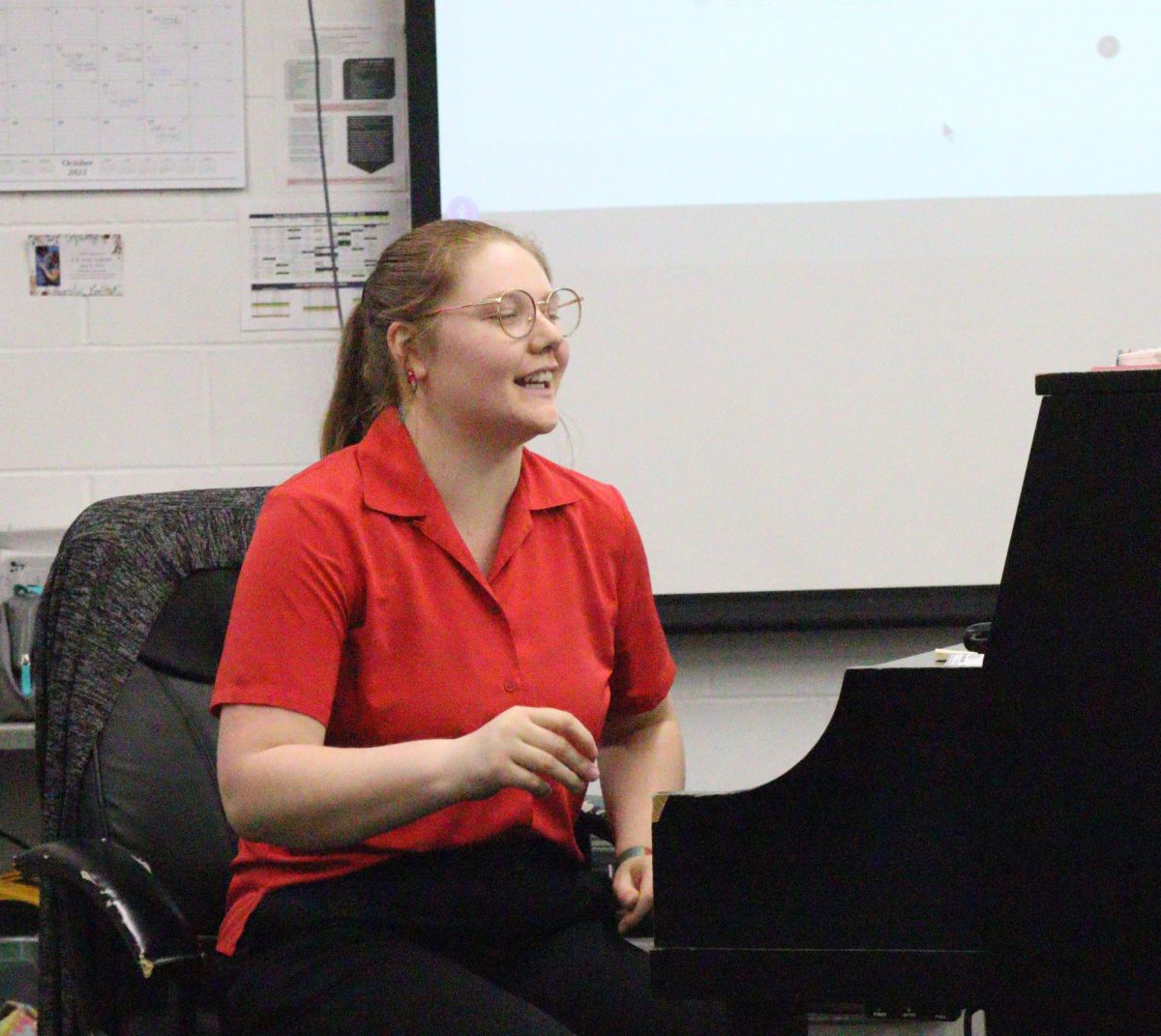 Sarah Wibben guides the high school choir  through a song. The class consisted of only four students this year.