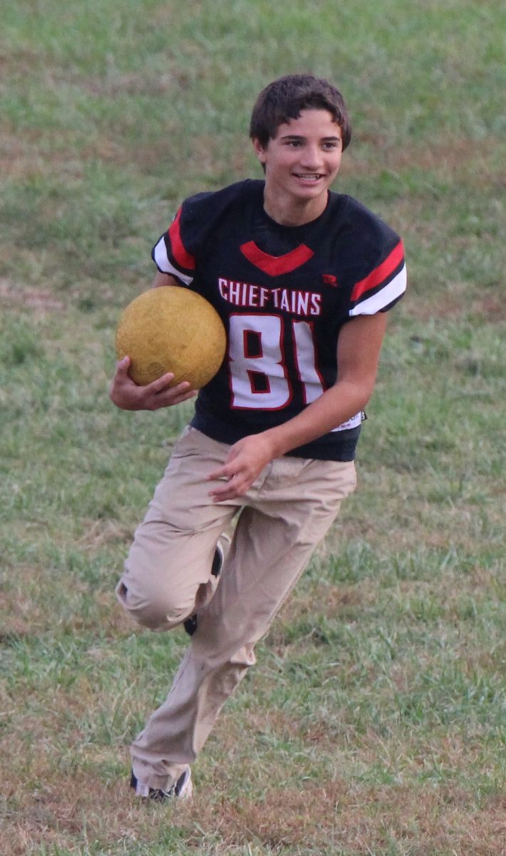 During an intense game of kickball, sophomore Landon Kumke runs the ball in after catching it. The sophomore class split into two teams to compete against each other. “My favorite part of the game was beating everyone,” Kumke said.