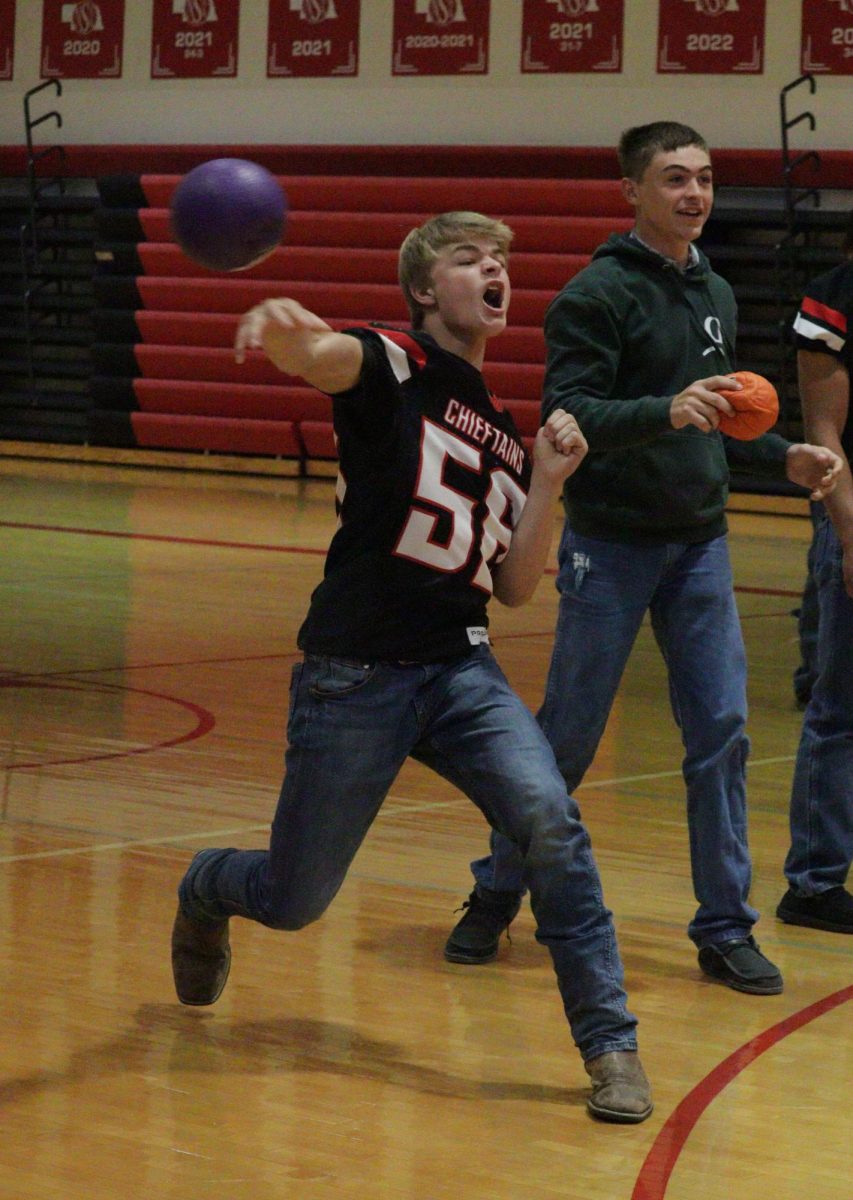 While playing dodgeball with his classmates, junior Hudson Bedlan throws the ball at a player on the other team. After poster making, the students could play dodgeball to pass the time. “My favorite part was dodgeball because we got to play a sport while being in school,” Bedlan said.