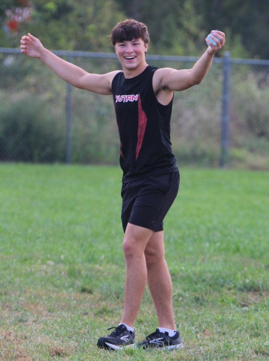 During the Chieftain Games, junior Otto Henkel cheers as they win the water balloon toss. Henkel and junior Nathan Daniell partnered to win the 10-12 grade division.  “Our strategy was to throw it really high to make sure it got to me,” Henkel said.