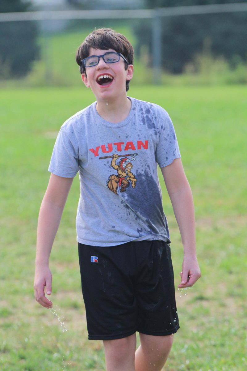 During the Chieftain Games, seventh grader Thomas Bauersachs laughs after getting soaked with a water balloon. Bauersachs was partnered with seventh grader Paisley Fenner, and they were eliminated during the second round. “I had fun getting splashed even though I got out second round,” Bauersachs said. “I’m happy I chose to do this for homecoming.”