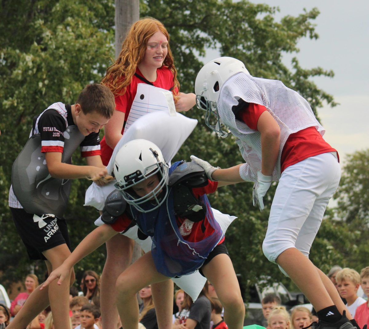 While riding on the seventh-grade homecoming float, Paisley Fenner gets hit with multiple pillows. The theme for their float was rock, paper, Clippers since the Yutan football team played the Malcolm Clippers during the homecoming game. “My favorite part about getting to ride on our homecoming float was getting to represent my class as being the one getting beaten up,” Fenner said. “I sure did laugh a lot and made a lot of kids laugh, which made me happy because that was the whole point.”
