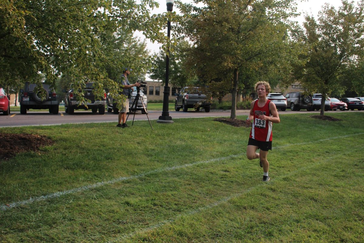 Junior Eli Kult races at the Boys Town cross country meet. This meet Kult ran a time of 20:43. (Anna Rupp)