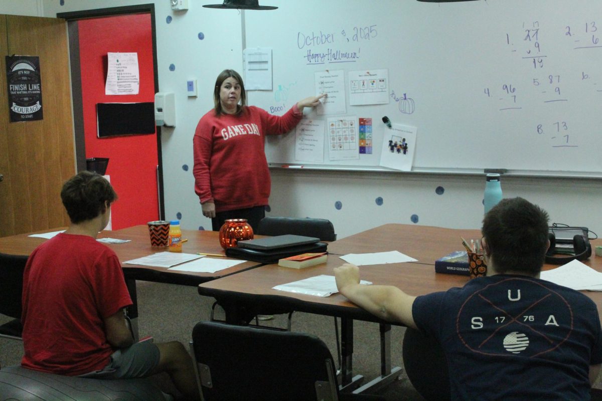  Special education teacher Tara Mumm teaches at the board to two of her students. This is Mumm's first year as a special education teacher.