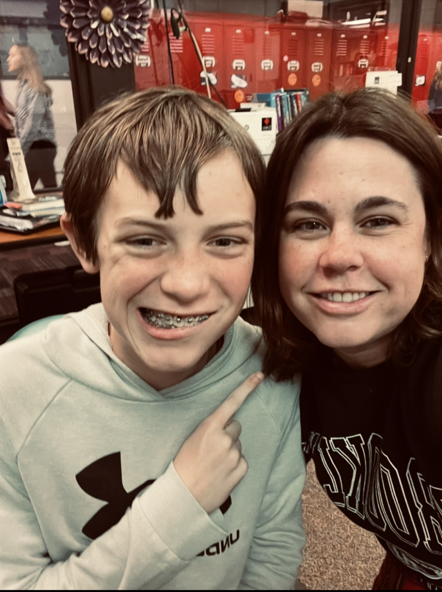 Special education teacher Tara Mumm and Freshman Alex Ray pose for a picture in her classroom. This is Mumm's first official year as a special education teacher.