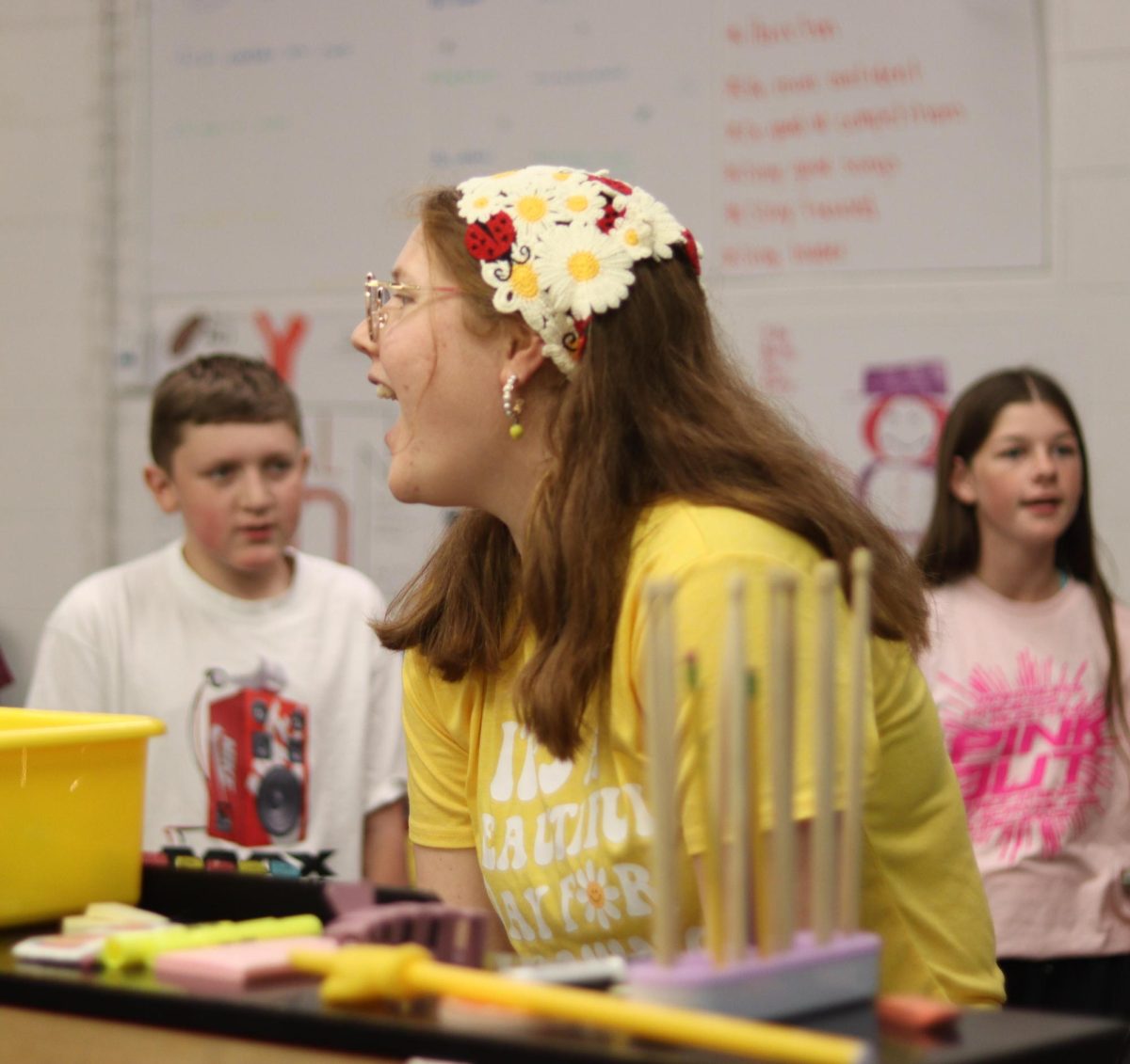 Choir teacher Sarah Wibben sits and plays piano for seventh-grade choir. Wibben is preparing her junior high classes for the upcoming fall concert.