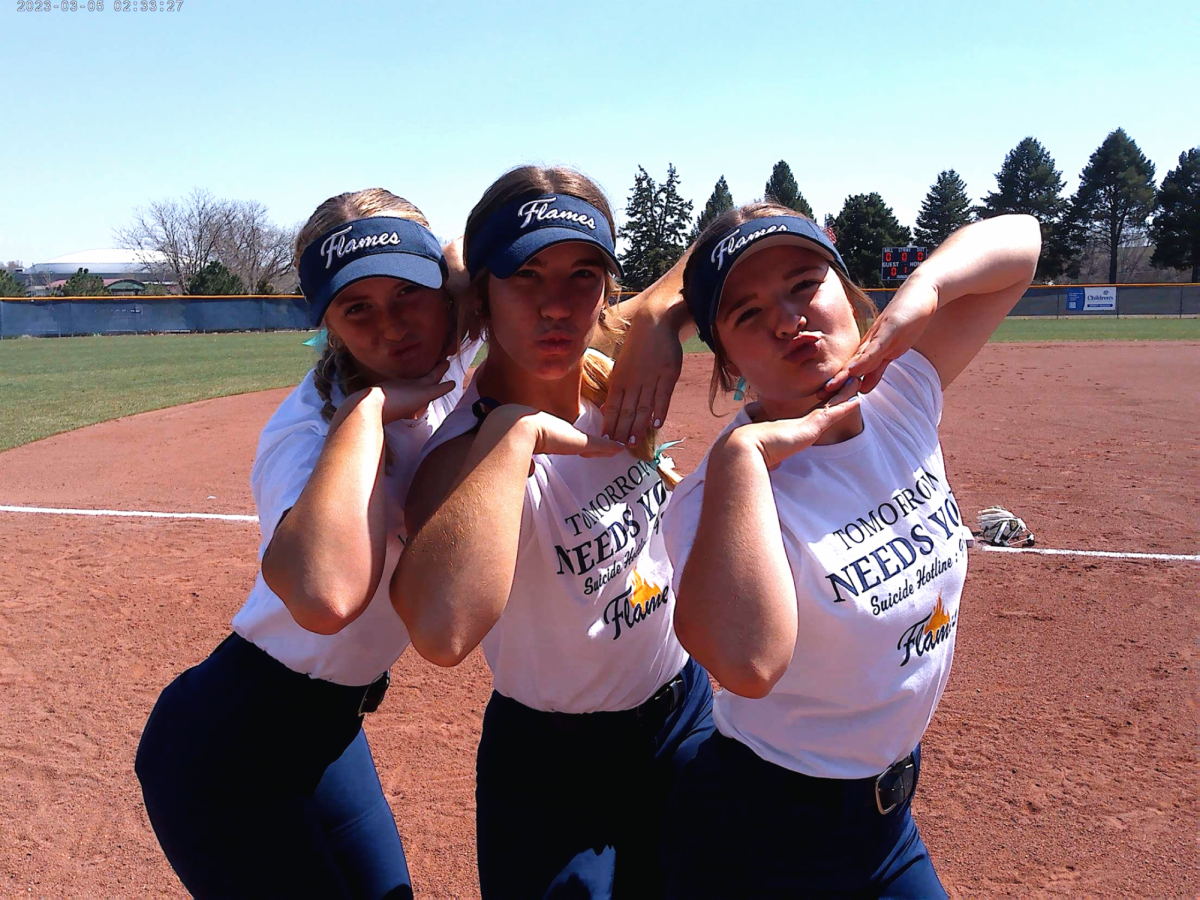 Shaylynn Campbell, Ella Watts and Maycee Hays pose together after a game. This game was their suicide prevention game. 