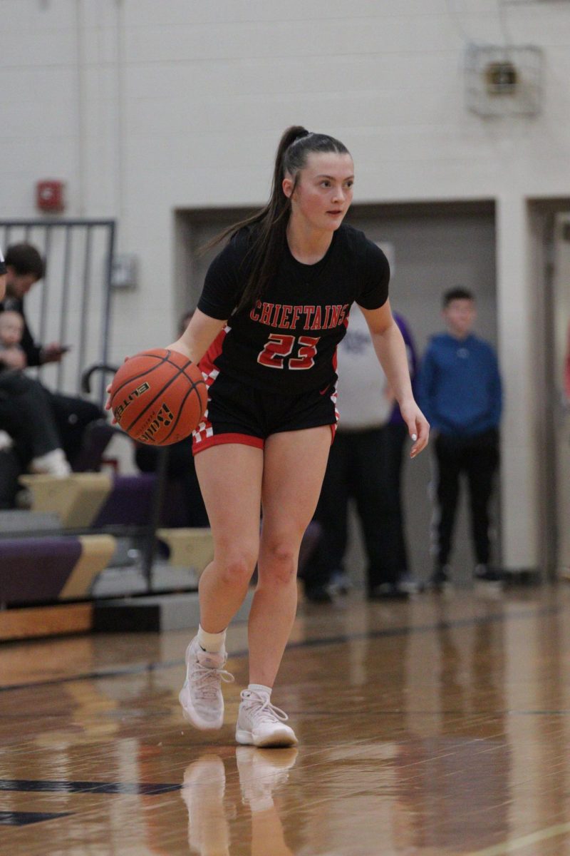 Jenna Benjamin dribbles the ball down the court in the conference final game. This was Yutan's fifth year in a row making it to the conference championship. 