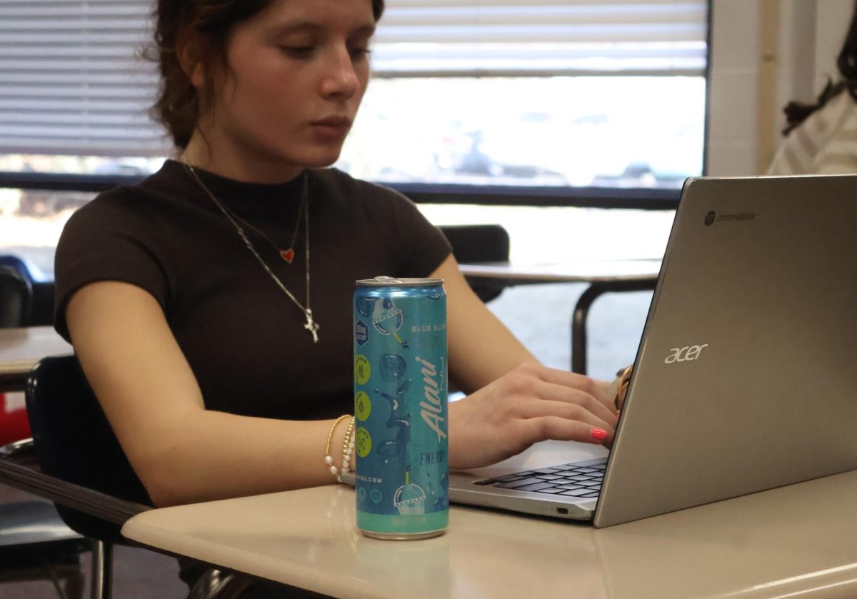 Hayleigh Darling works on Journalism homework while drinking an Alani. Darling has 5 Alanis on average per week.