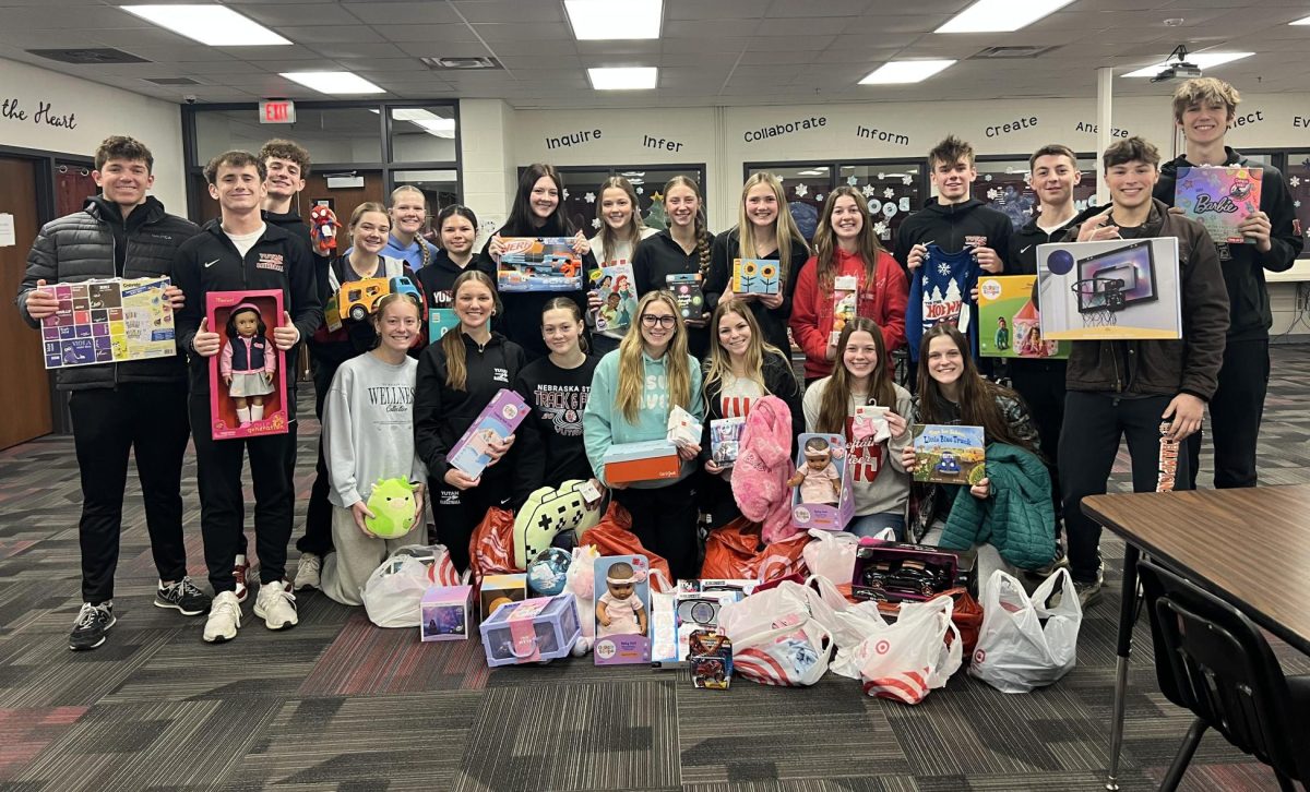 NHS members pose for a picture after buying gifts for the families they adopted.  Out of all the events NHS does, this is the students favorite to participate in.