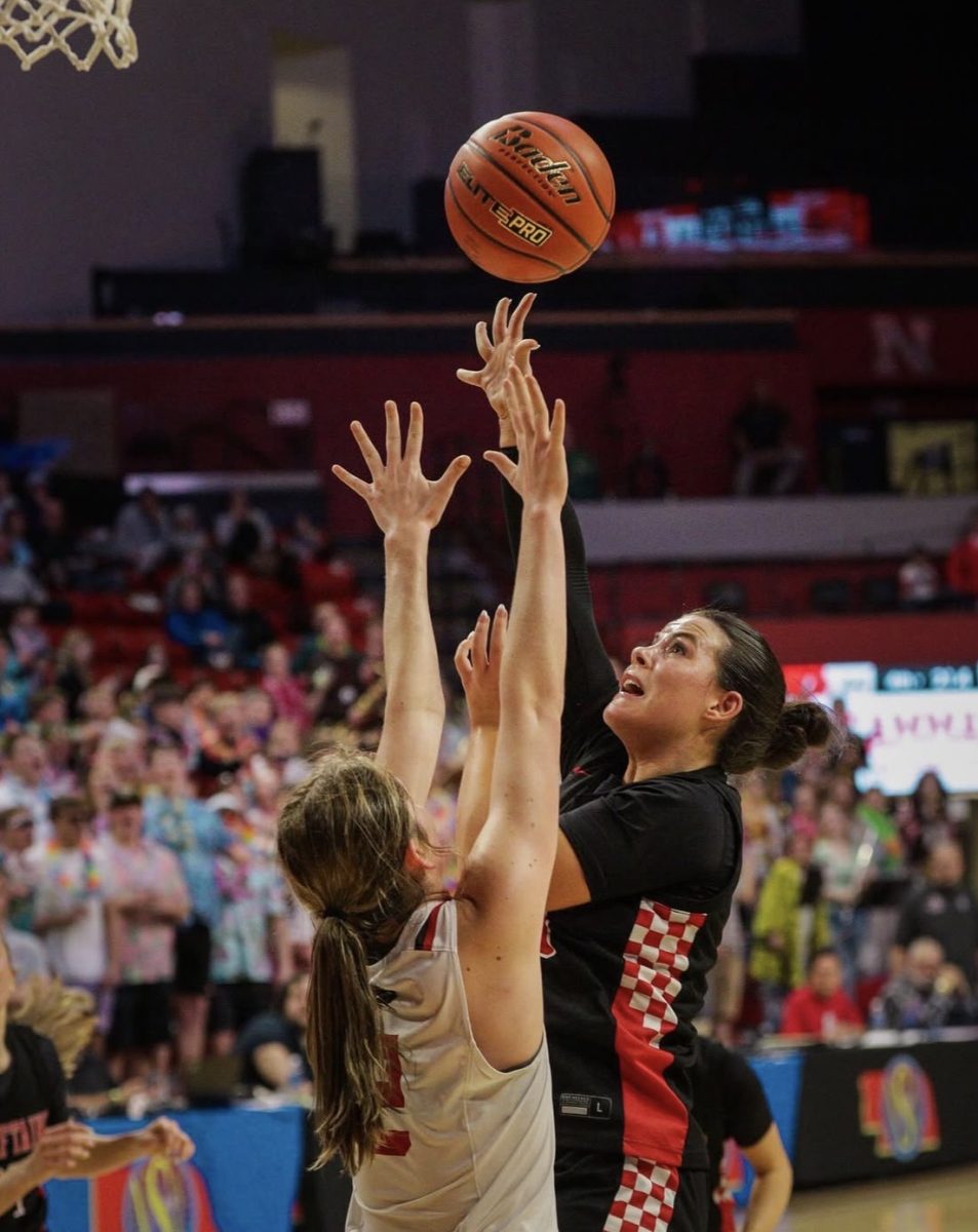 Jenna Trent shoots a shot in the state tournament. Trent was the highest rebounder on the team averaging 7.9 rebounds per game.
