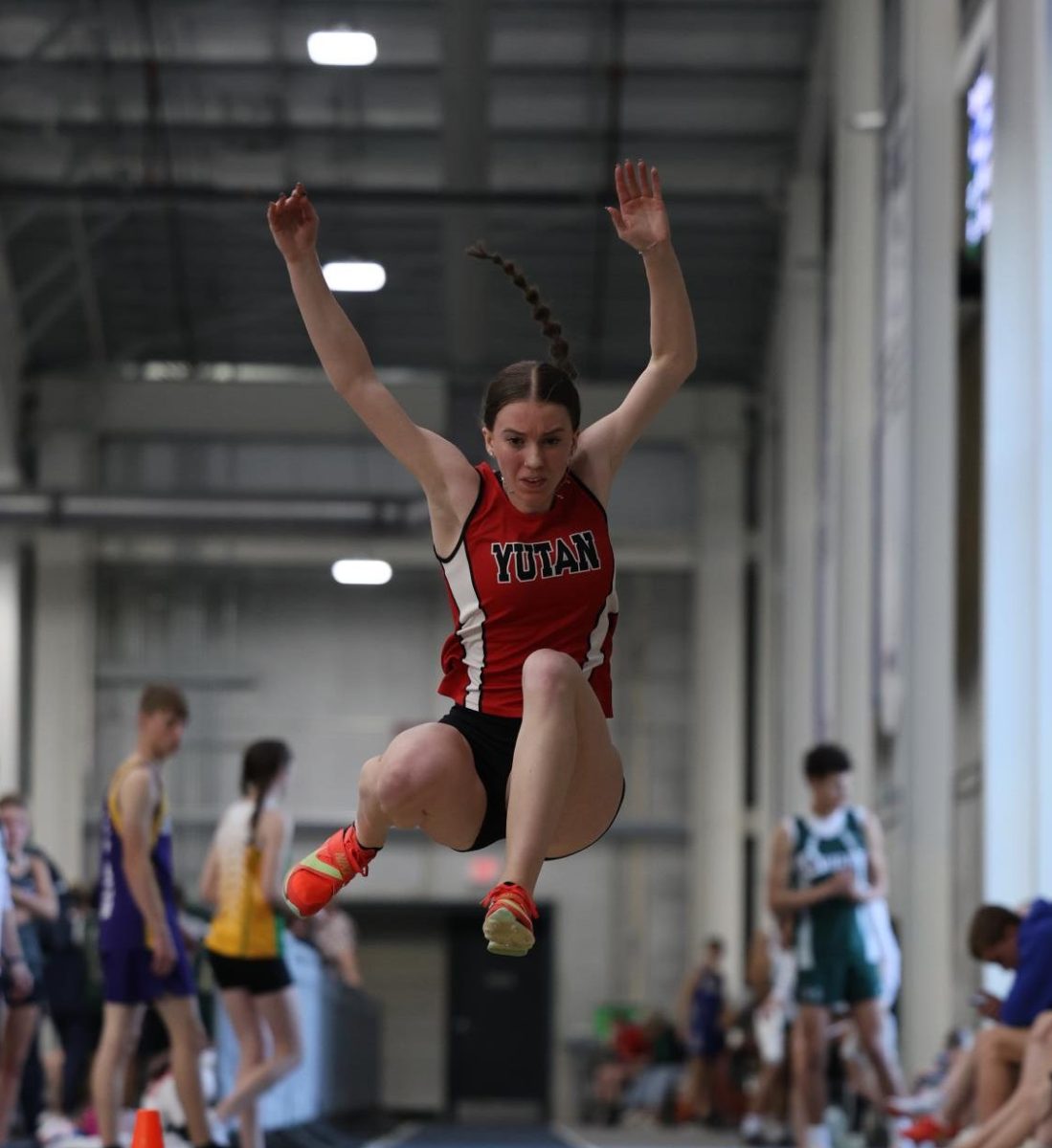 Senior Molly Besch jumps into a pit at the indoor Concordia meet, the first of the year. She jumped a PR of 17.00.